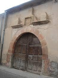 Puerta y fachada casa Muñoveros